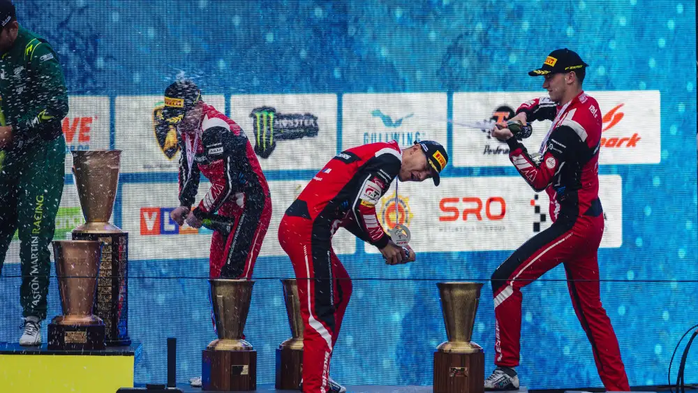 Team WRT drivers celebrating on the podium at the 2024 24 Hours of Spa